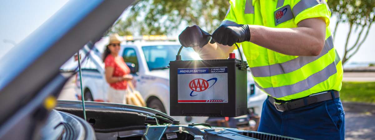 AAA Battery Service Technician installing vehicle battery