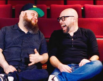 four men in a theater