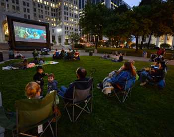 people watching outdoor evening movie