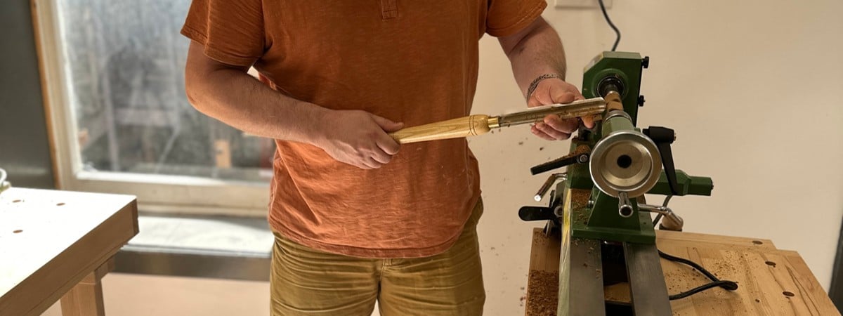 photo of student working on lathe