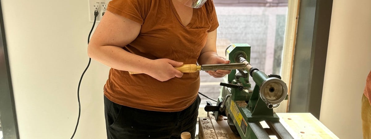 photo of student working on lathe