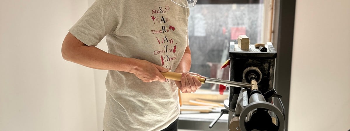 photo of student working on lathe