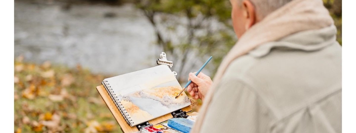 Woman painting outdoors