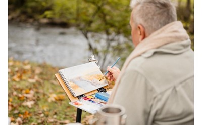 Woman painting outdoors