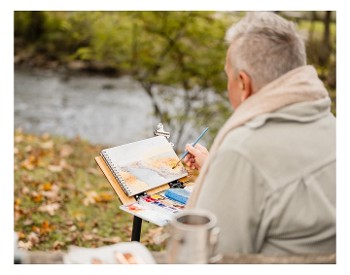 Woman painting outdoors