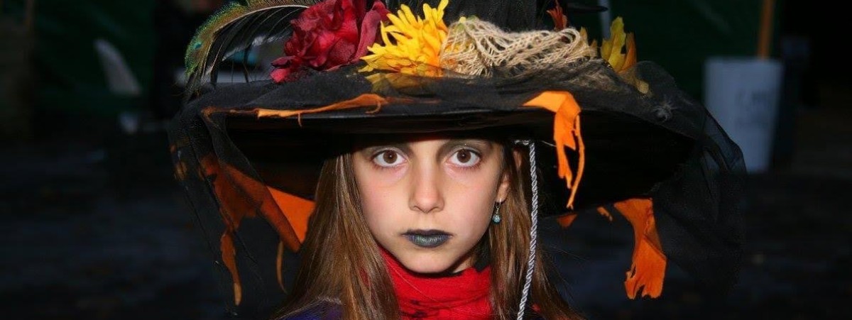 young girl dressed as witch