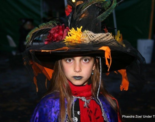 young girl dressed as witch