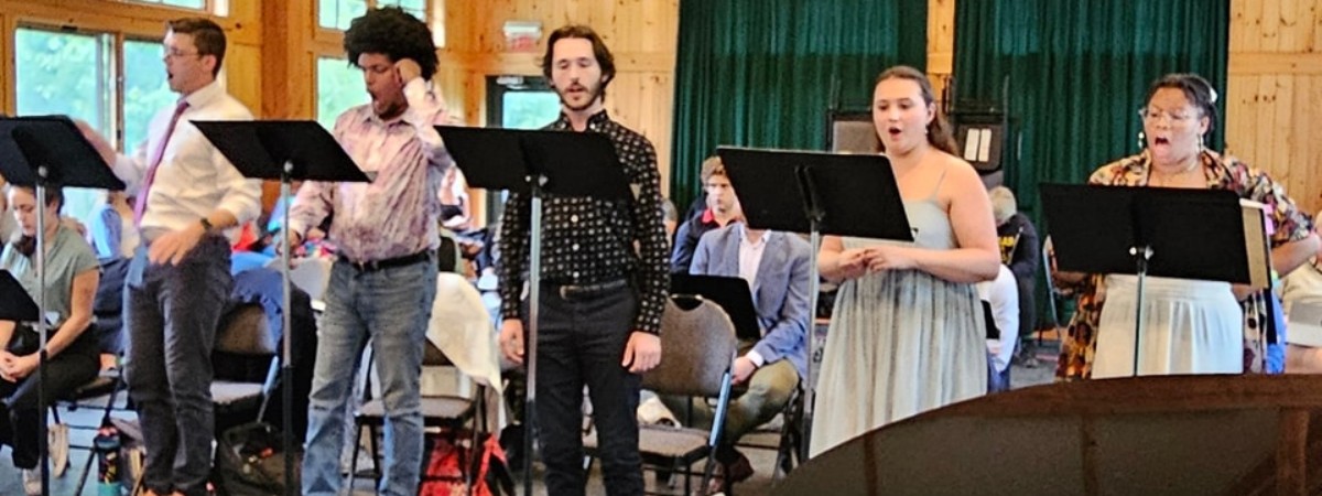 A group of singers standing at music stands