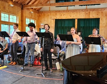 A group of singers standing at music stands