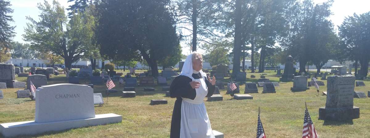 women reenactor in cemetery