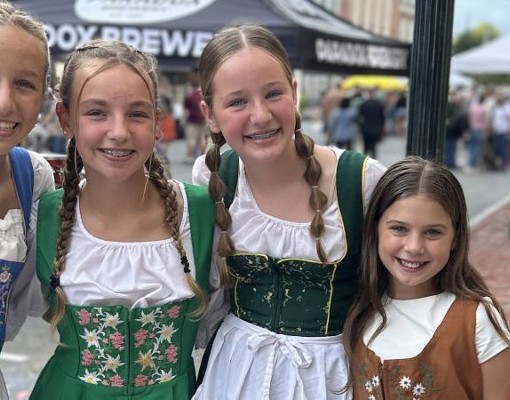 young girls dressed in german outfits