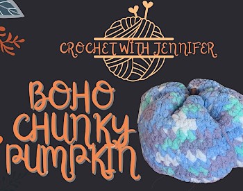 Crocheted pumpkin shape in tones of blue with a drawing of a ball of yarn with knitting needles