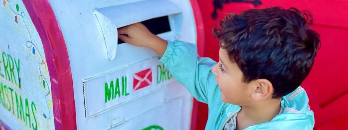 Roman dropping Santa letter