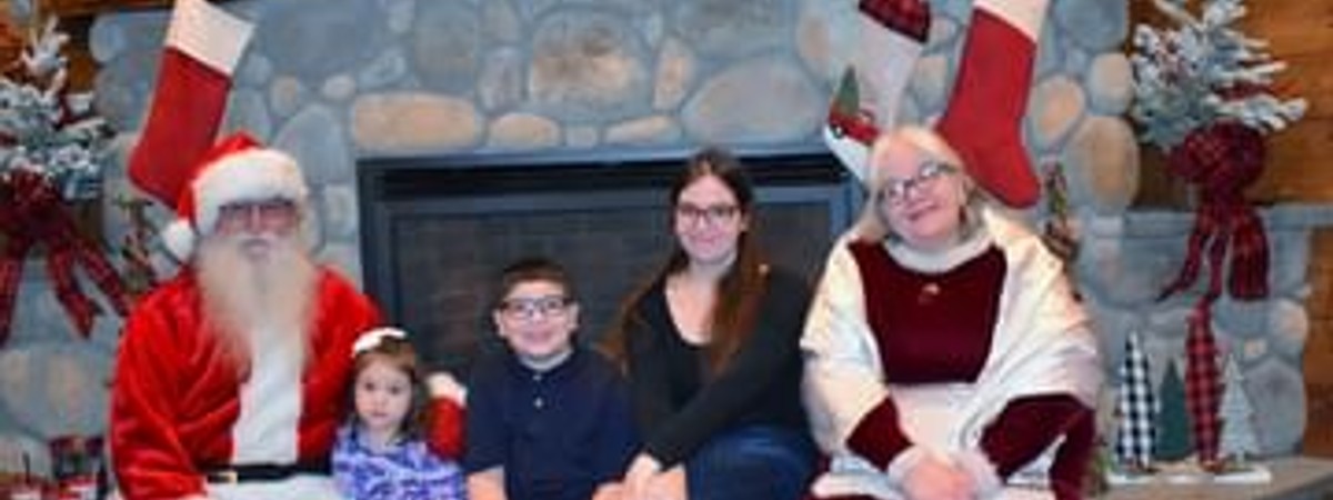 kids pose with santa