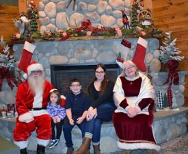 kids pose with santa