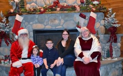 kids pose with santa