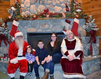 kids pose with santa