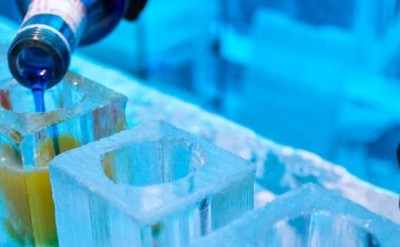 drink being pourced in ice at ice bar