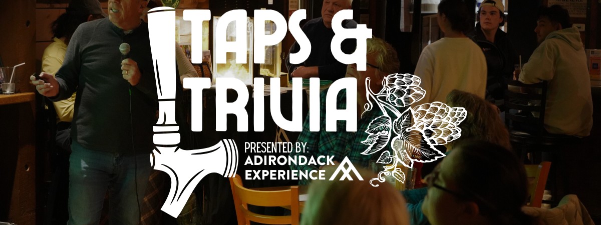 Taps & Trivia logo with Full crowd at the Garrison in the background