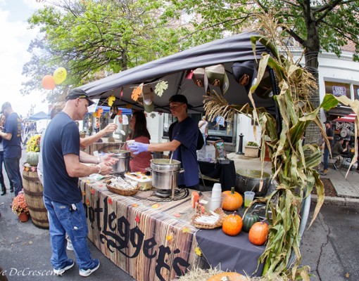 people getting chowder samples at a vendor booth