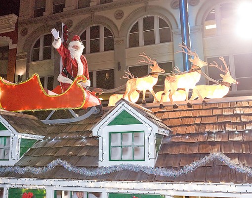 Santa and reindeer on roof in parade