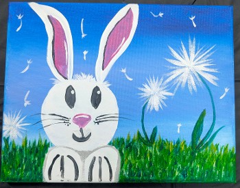 Painted white bunny with dandelions and grass