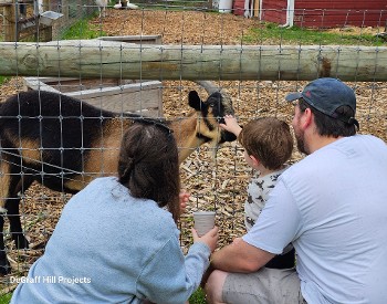 Photo of family at City Goat Farm from last year's Farm Showcase.