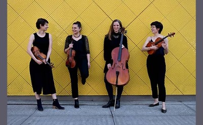 four musicians pose