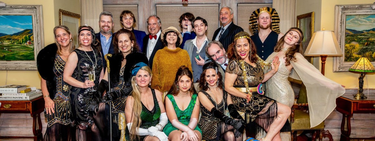 Murder Mystery Dinner participants at The Wilburton pose in their glamorous outfits.