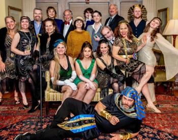 Murder Mystery Dinner participants at The Wilburton pose in their glamorous outfits.