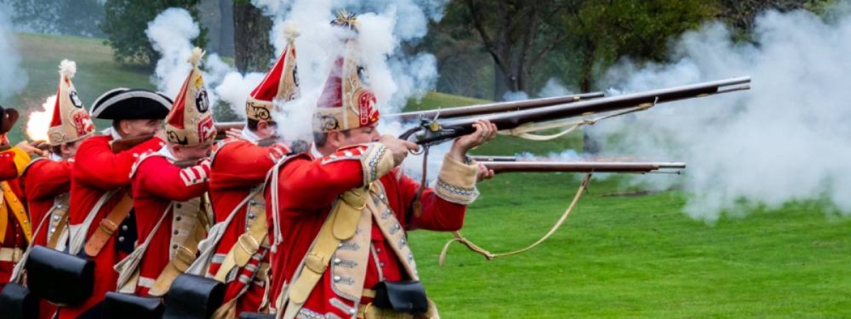 group of reenactors firing muskets