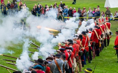group of reenactors firing muskets