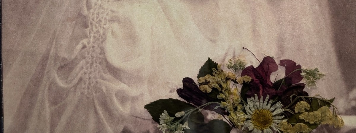 bride with pressed flowers inside the frame