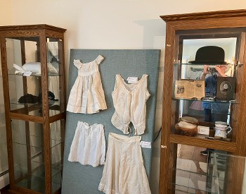 Garments and accessories on display at Parks-Bentley Place's historic house.