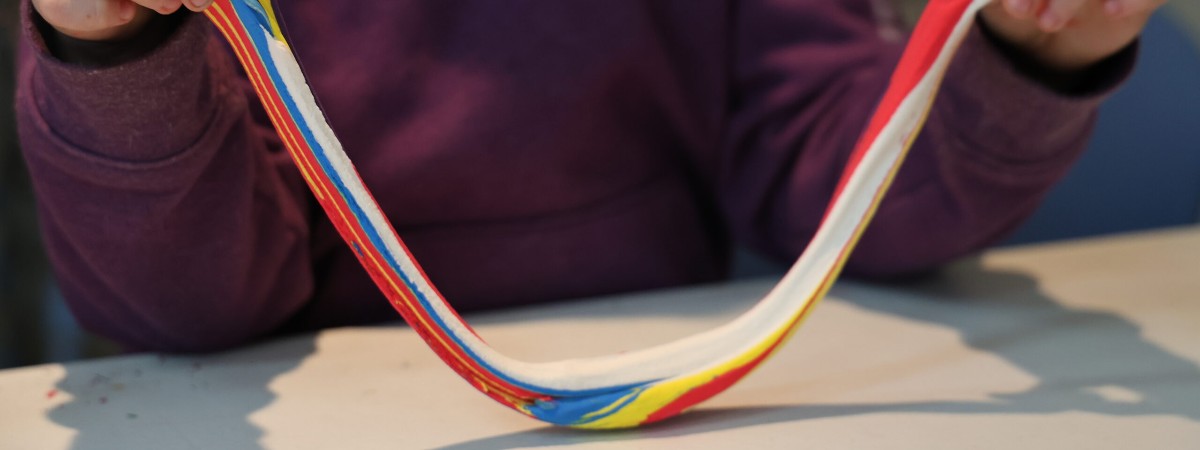 A participant working with colored clay.