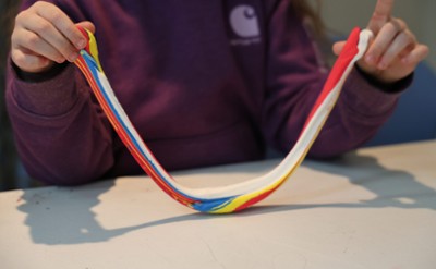A participant working with colored clay.