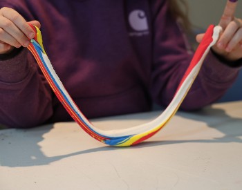 A participant working with colored clay.