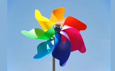 A colorful pinwheel against the sky. 