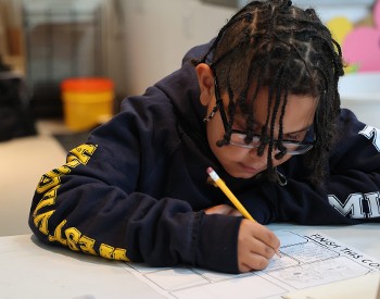 A child works on a graphic novel at The Hyde.