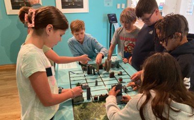 Children play with a city model at The Hyde Collection.