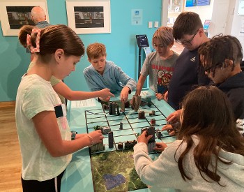 Children play with a city model at The Hyde Collection.