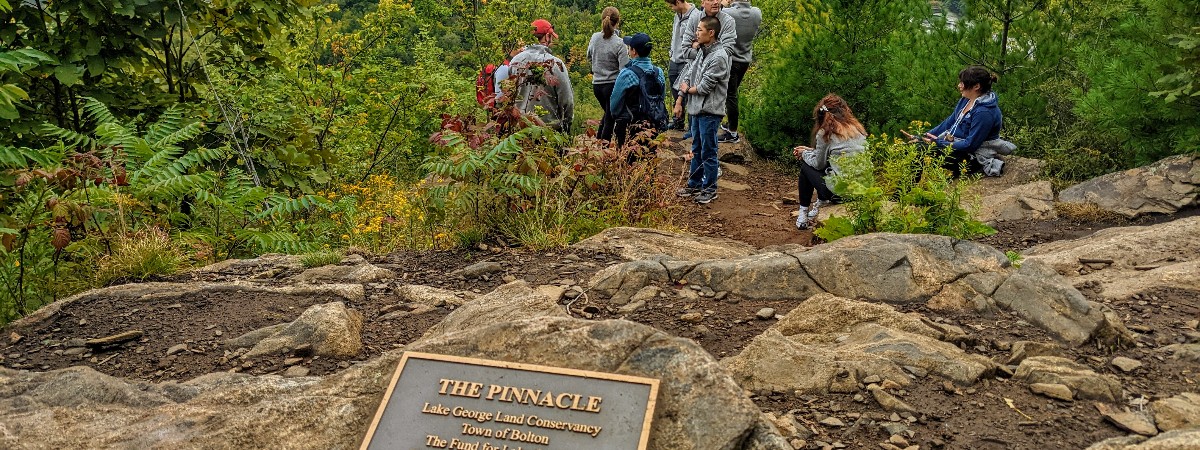 people at summit of the pinnacle