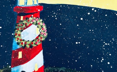 A painting of a lighthouse on the beach, with snow and a Christmas wreath