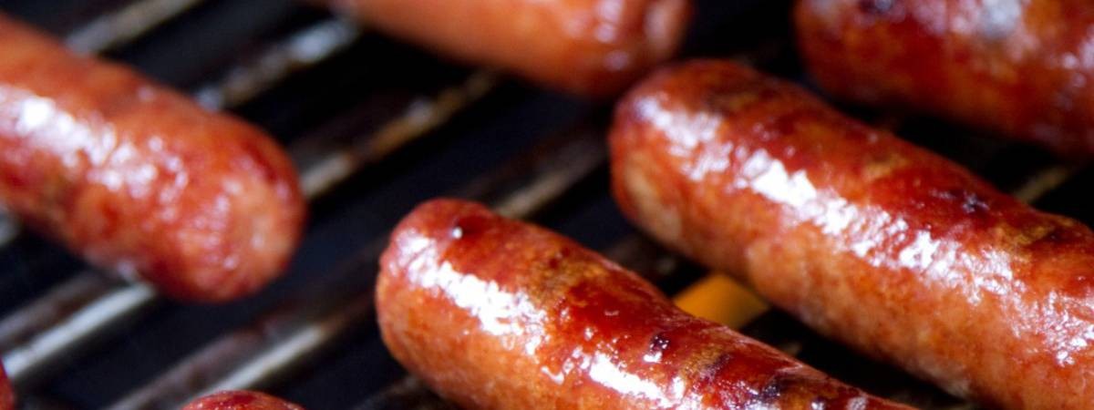 hot dogs on grill