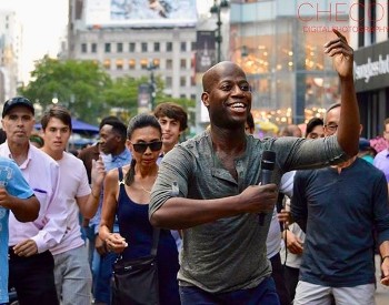 Sekou McMiller performs at a community event