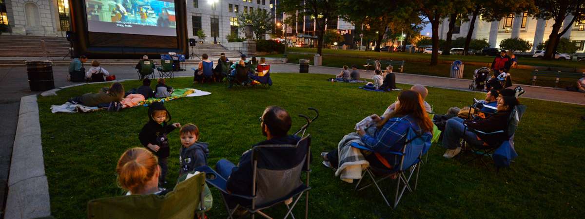 people watching outdoor evening movie