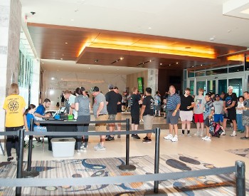 Cornhole for a cause players sign in at Rivers Casino Event Space.