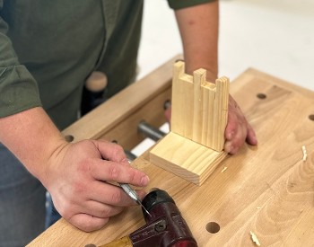 a man holds his hand cut dado joint