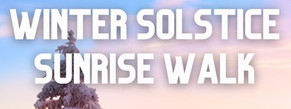 white words in all caps over an image of a snow covered tree and sunrise sky. Words read "Winter Solstice Sunrise Walk"