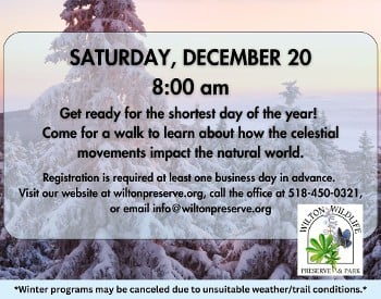 white words in all caps over an image of a snow covered tree and sunrise sky. Words read "Winter Solstice Sunrise Walk"